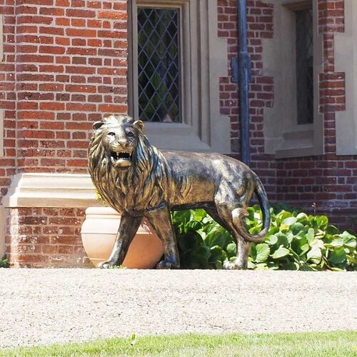 Cast aluminium standing lion statue, looking left